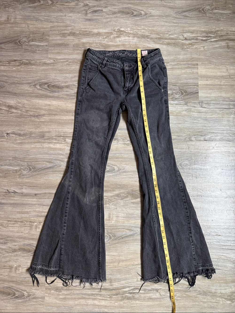 We The Free Washed Black Flare Jeans with Frayed Hem
